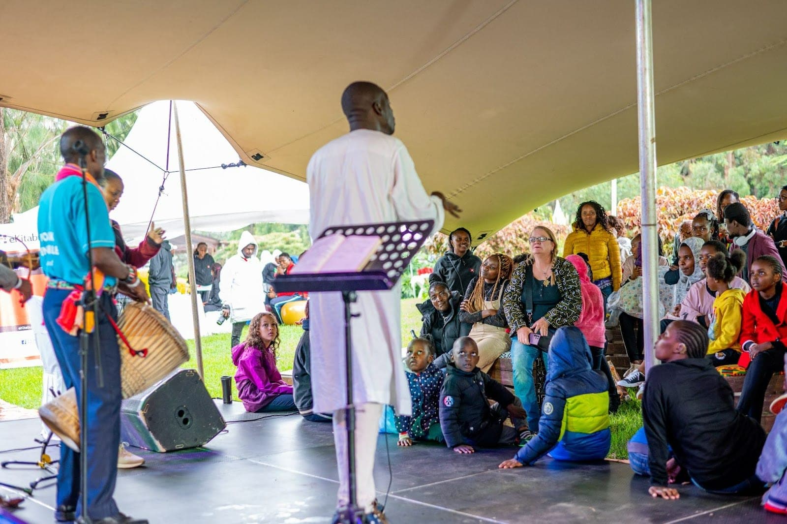 Children and parents enjoying a storytime session during the Sol Kids Easter Festival at The Hub, Karen.